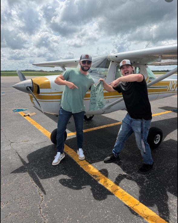 Blackstone Aviation instructor and student celebrating a first solo flight tradition